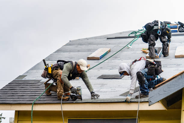Professional Roofing technician working in Stow, MA